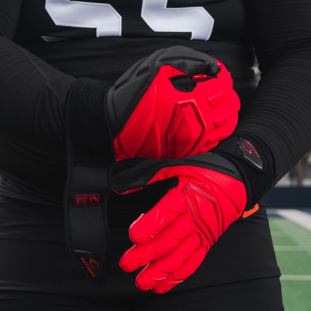 Athlete Wearing Cutters 6.0 Lineman Gloves in Red