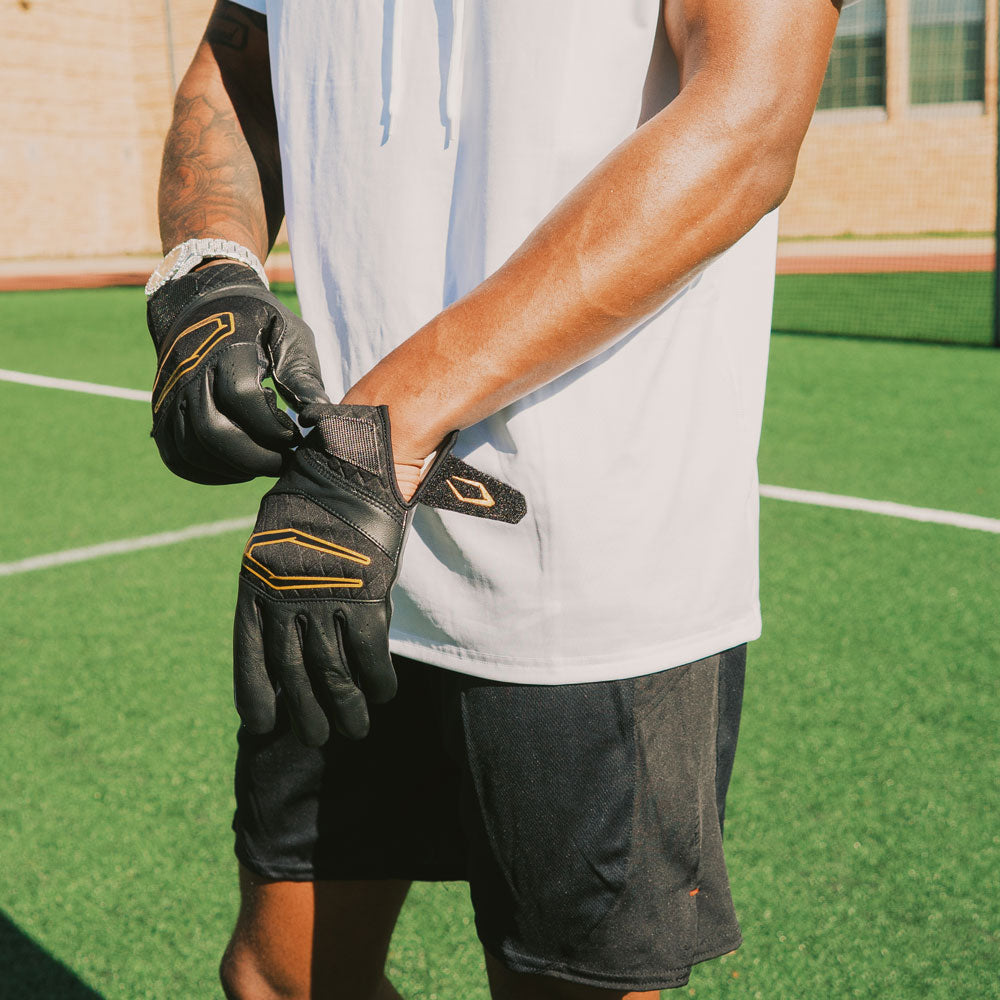 Aaron Butler Pulling Cutters Rev X Elite Black/Gold Receiver Football Gloves Over Wrist for Better Fit