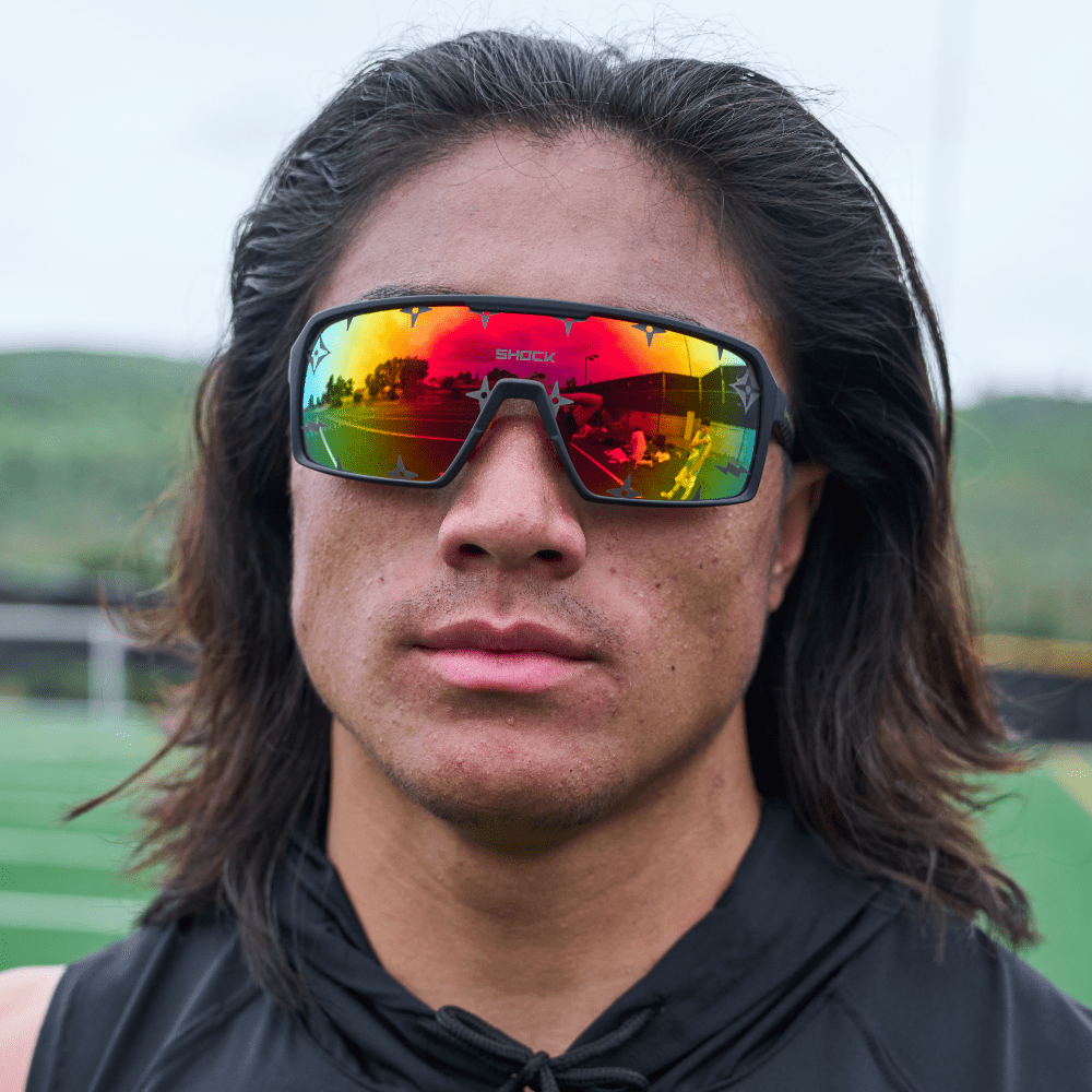Shock Doctor Showtime Sunglasses - Black Frame & Orange Lenses -  Lifestyle Shot on Youth 7v7 Football Player