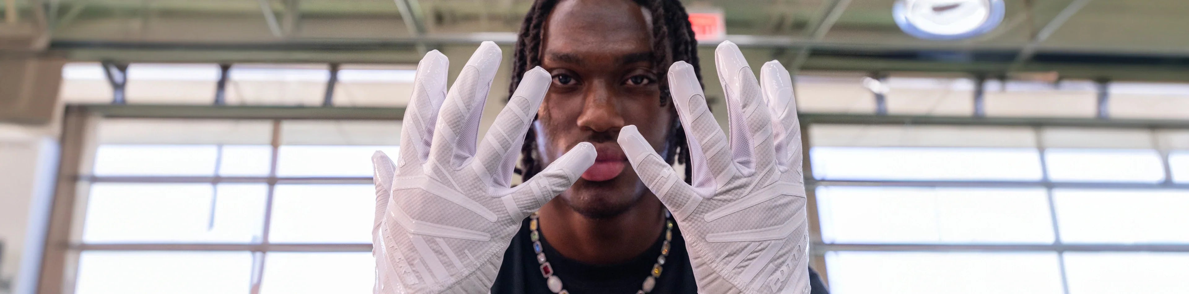 Header image for the 'Adult Football Gloves' Collection by Cutters Sports. NFL athlete Marvin Harrison Jr. showcases his top football gear selections, highlighting performance gloves and game-ready accessories.