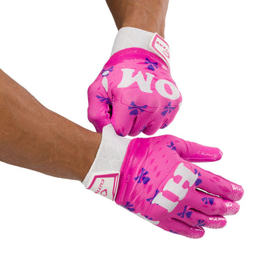 Cutters Sports Hi Mom Rev Pro 5.0 Limited-Edition Receiver Football Gloves - Pink - Football Player Pulling Glove Over Wrist for Better Fit