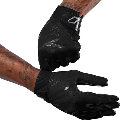 Cutters Sports Rev Pro 6.0 Solid Receiver Football Gloves - Black - Football Player Pulling Glove Over Wrist for Better Fit