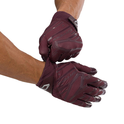 Cutters Sports Rev Pro 6.0 Solid Receiver Football Gloves - Maroon Red - Football Player Pulling Glove Over Wrist for Better Fit