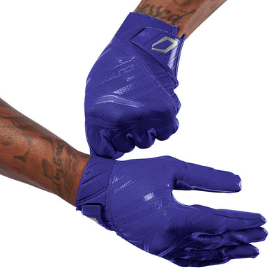 Cutters Sports Rev Pro 6.0 Solid Receiver Football Gloves - Purple - Football Player Pulling Glove Over Wrist for Better Fit