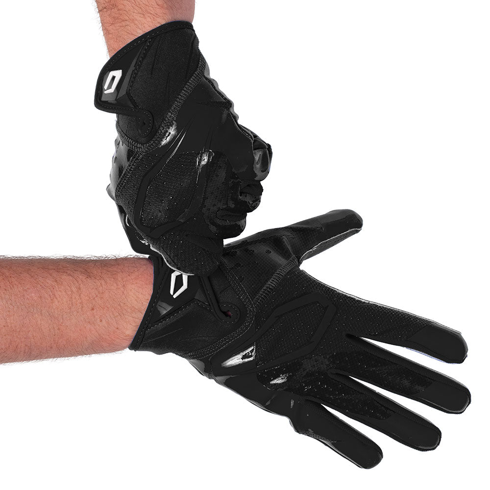 Player wearing Black Cutters Rev Pro 7.0 football receiver gloves, hands crossed at the wrists