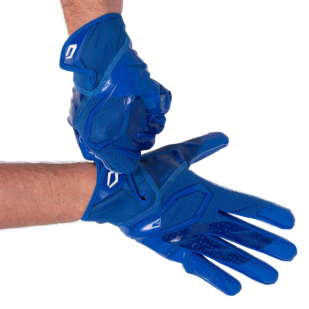 Player wearing Royal Blue Cutters Rev Pro 7.0 football receiver gloves, hands crossed at the wrists