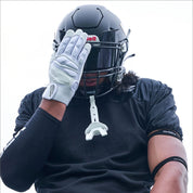 Lifestyle Image of Youth Football Player Wearing Force 5.0 Lineman Gloves in White