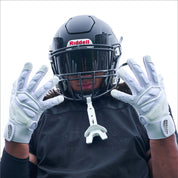 Lifestyle Image of Youth Football Player Wearing Force 5.0 Lineman Gloves in White