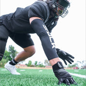 Lifestyle Image of Youth Football Lineman Wearing Force 5.0 Gloves