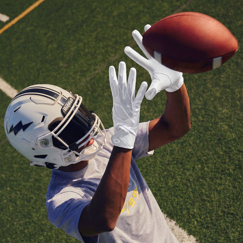 football gloves on helmet Phenom Elite AfterDark Step into the shadows and take over the game with the Phenom Elite Football Gloves NXTRND Adult G2 Pro Skeleton