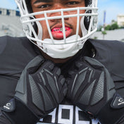 Athlete Wearing Cutters 6.0 Lineman Gloves in Black