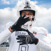 Athlete Wearing Cutters Rev Pro 6.0 Limited Edition Football Receiver Gloves in Black/White Lux Print