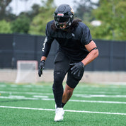 Lifestyle Detail Shot of Football Player Wearing Cutters Gamer 5.0 Padded Receiver Gloves in Black